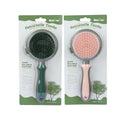 self-cleaning slicker brush ejecting a clump of dog fur